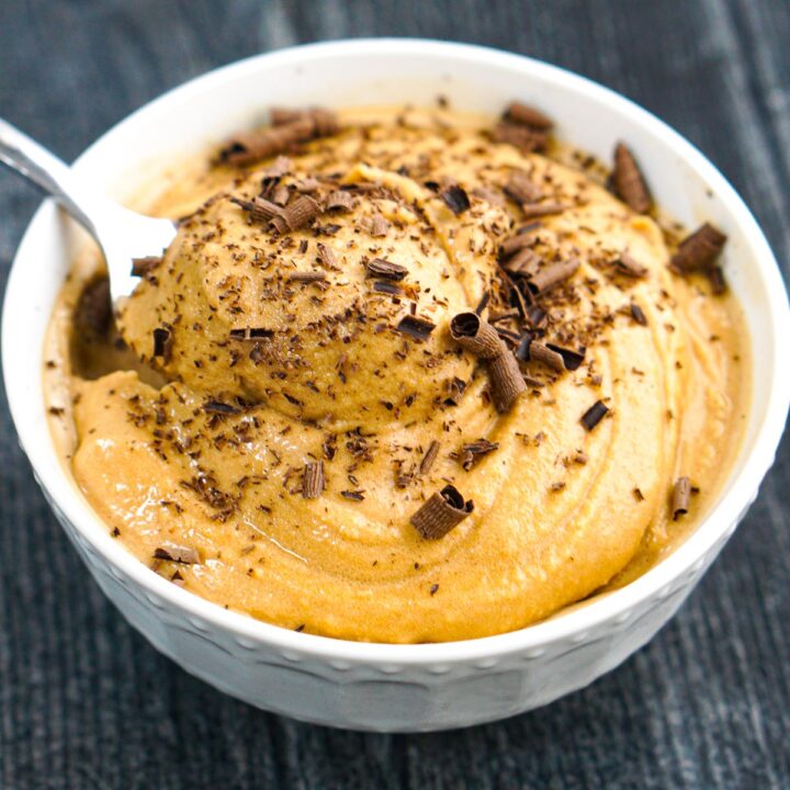 white bowl with Ninja Creami coffee ice cream with chocolate shavings on top