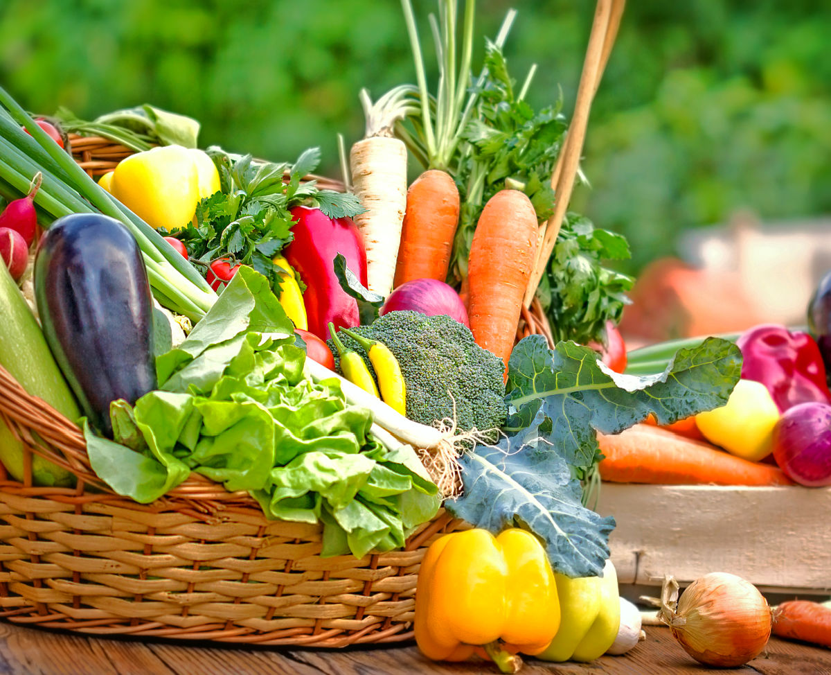 wicker basket filled with fresh summer vegetables