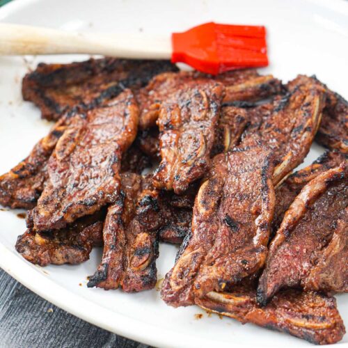 white platter with bbq grilled flanken ribs appetizer
