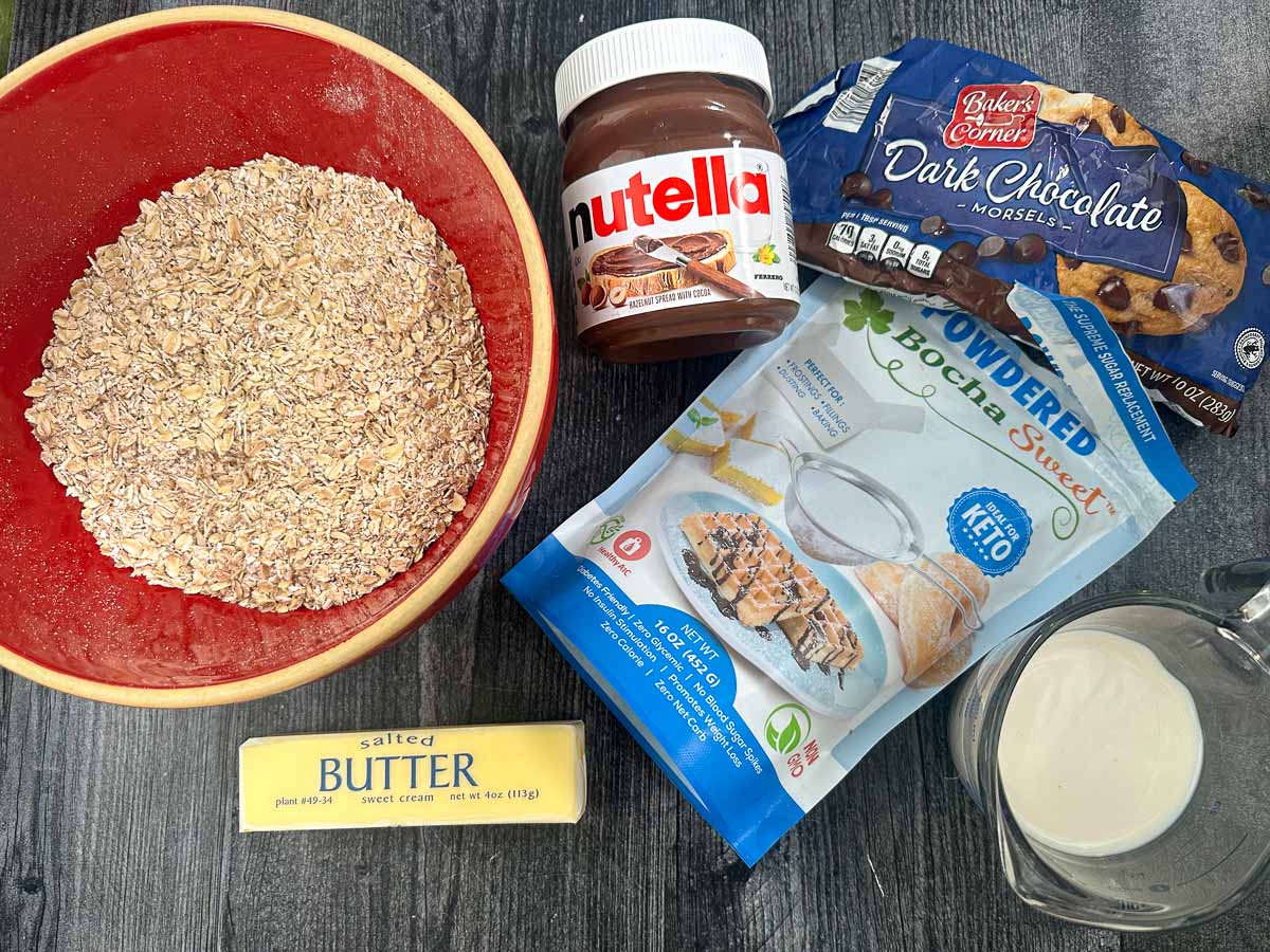 recipe ingredients - oats, sweetener, almond milk, chocolate chips, butter and Nutella