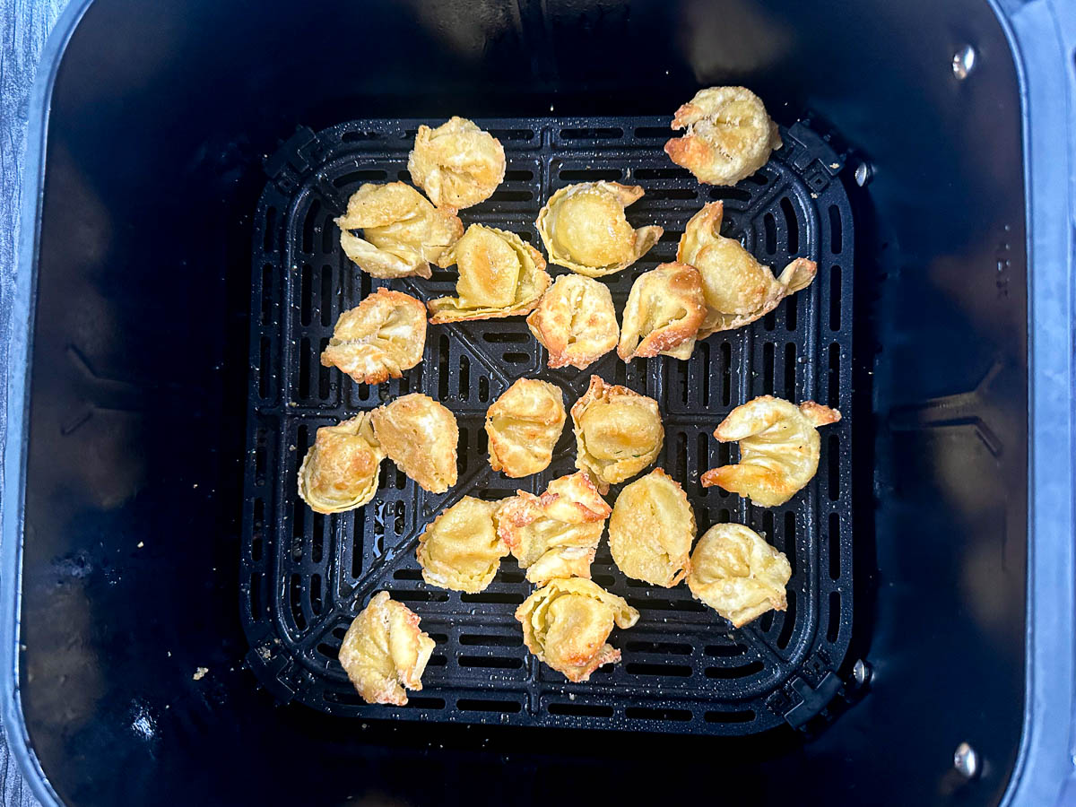 air fryer basket with finished fried tortellini