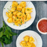aerial view of white plates with air fried tortellini and fresh basil with text