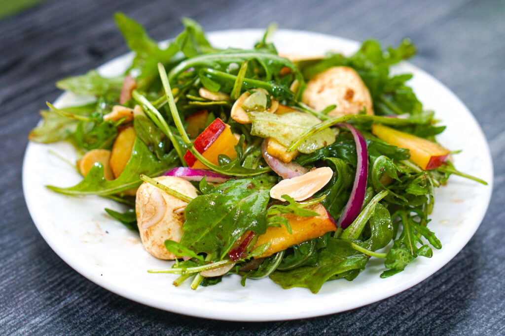 Easy Peach Arugula Salad with mozzarella & balsamic dressing.