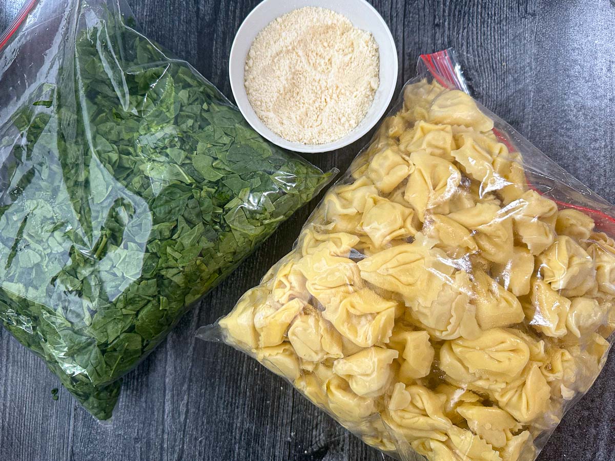 recipe ingredients - spinach, parmesan cheese and tortellini