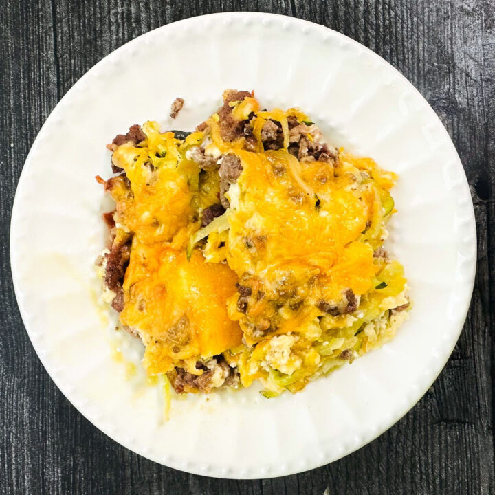 white plate with a serving of keto squash and ground beef casserole