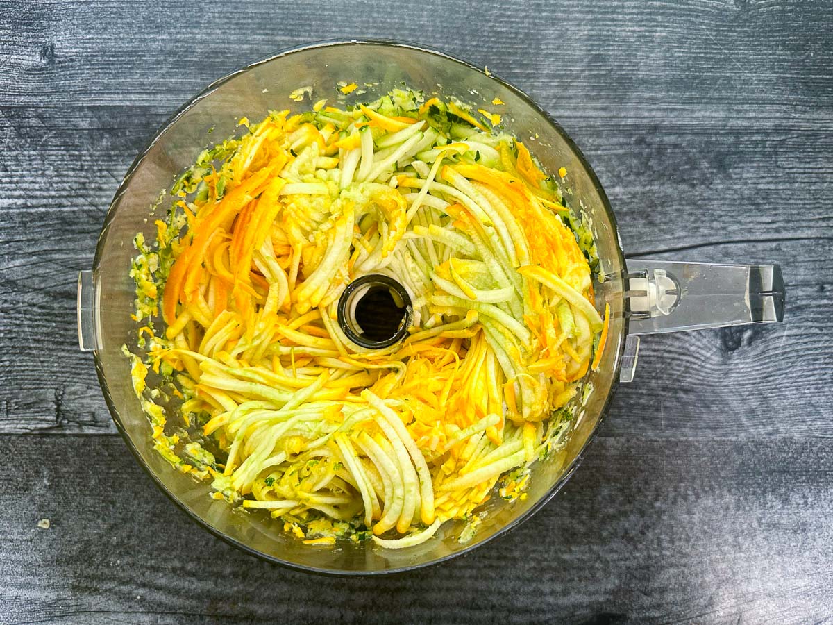 food processor bowl with grated squash
