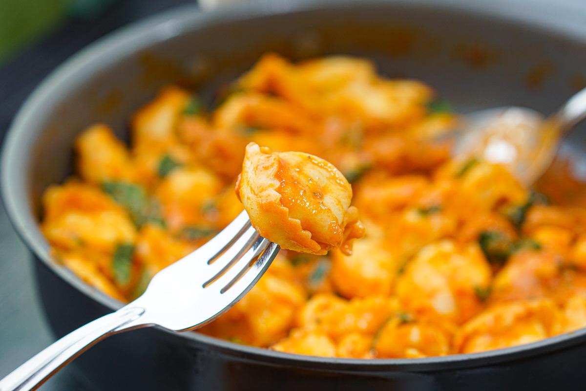 a fork with a piece of tortellini on it