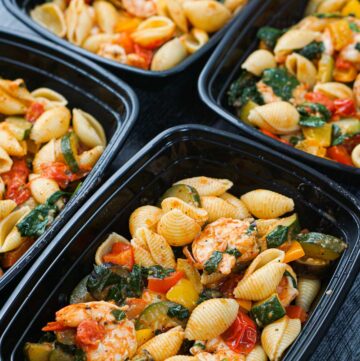 black freezer containers with low calorie shrimp pasta meal