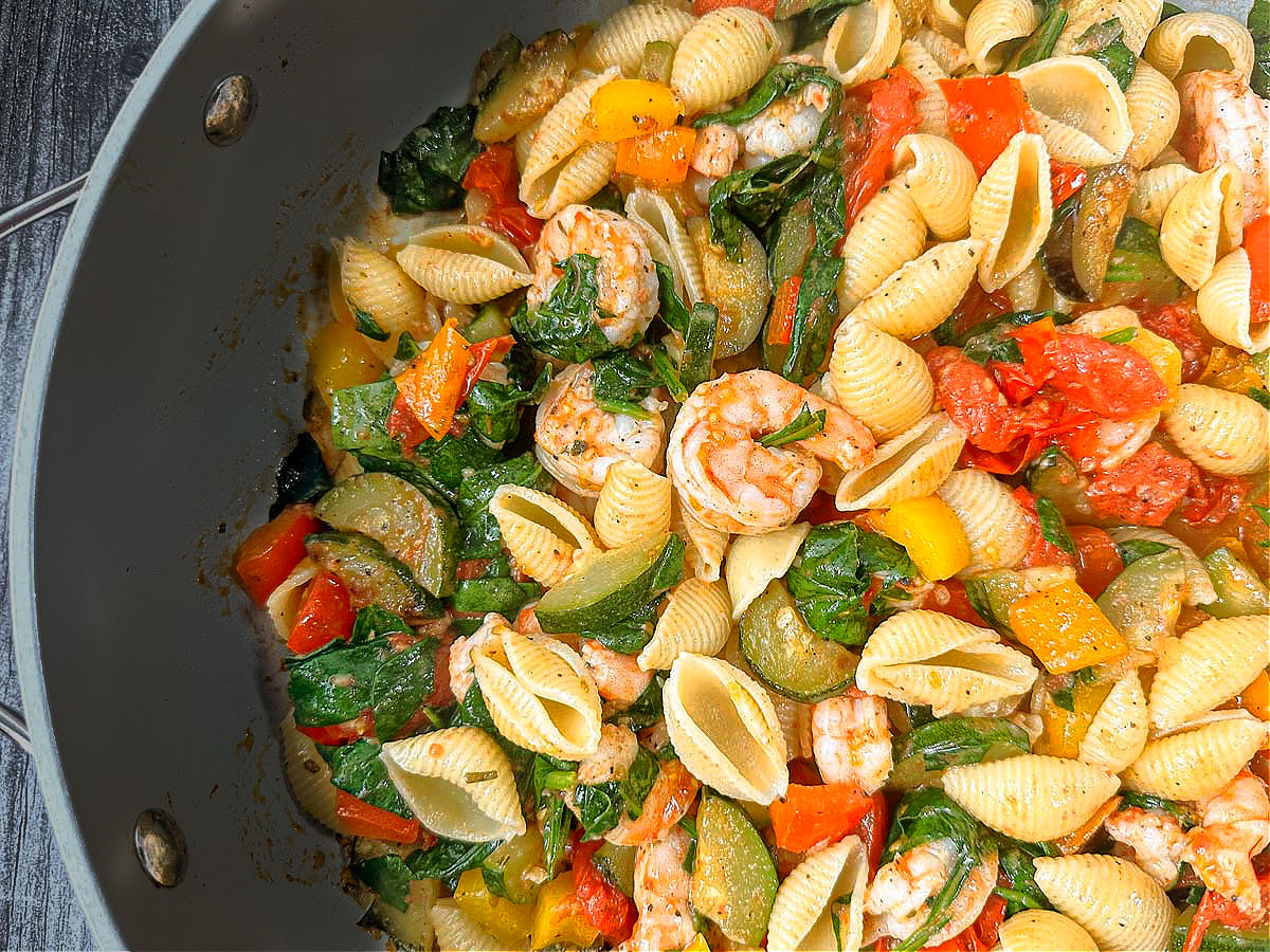 closeup of a pan of seafood and vegetable pasta