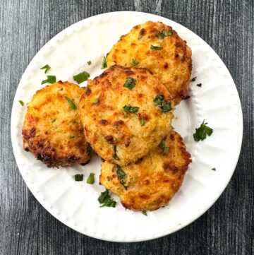 white plate with 4 keto air fryer chicken patties