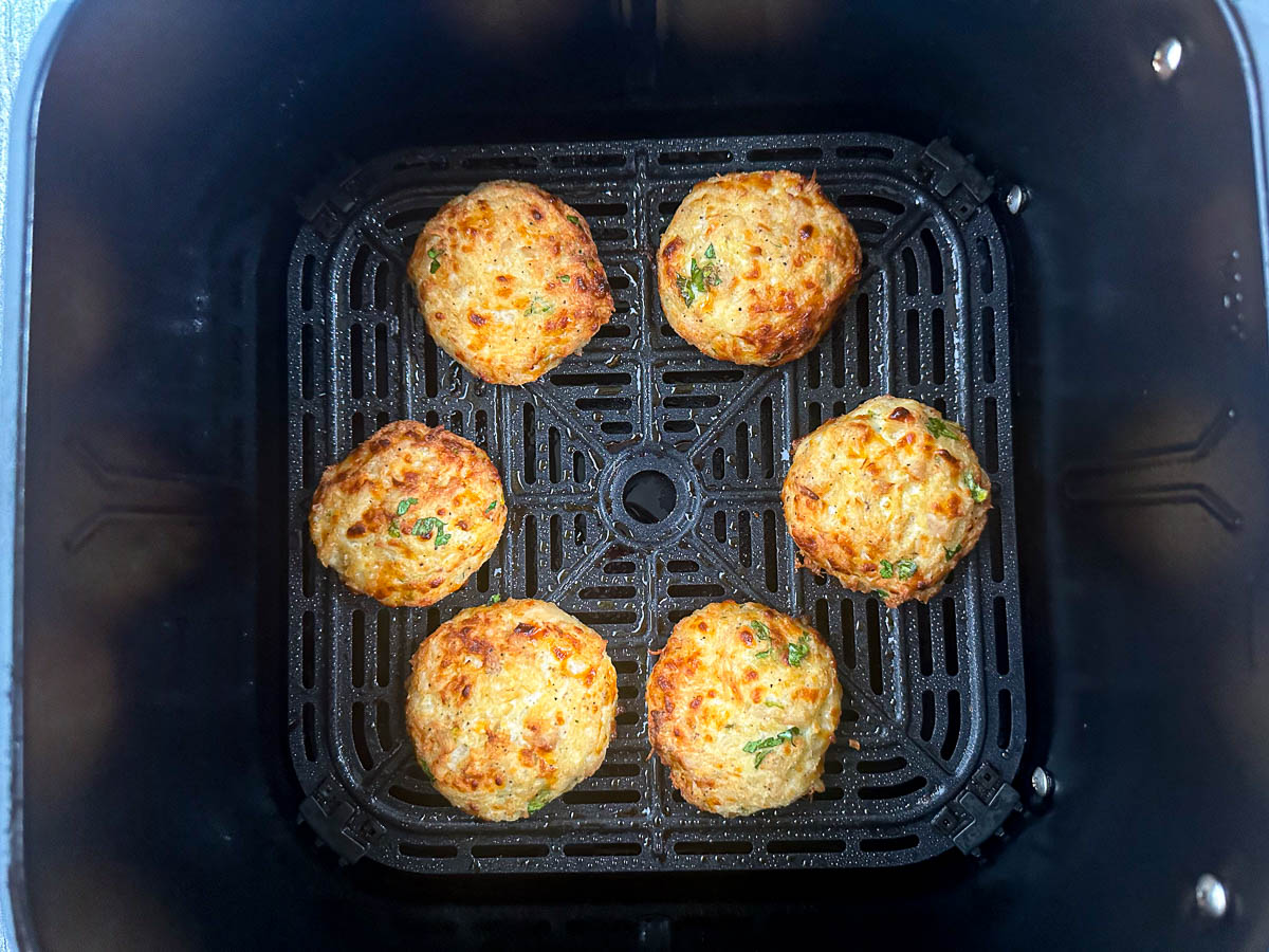 air fryer basket with finished chicken patties