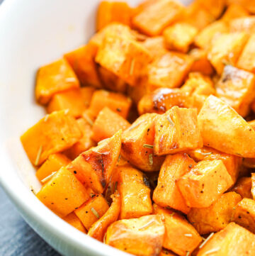 closeup of a white bowl with air fryer sweet potatoes