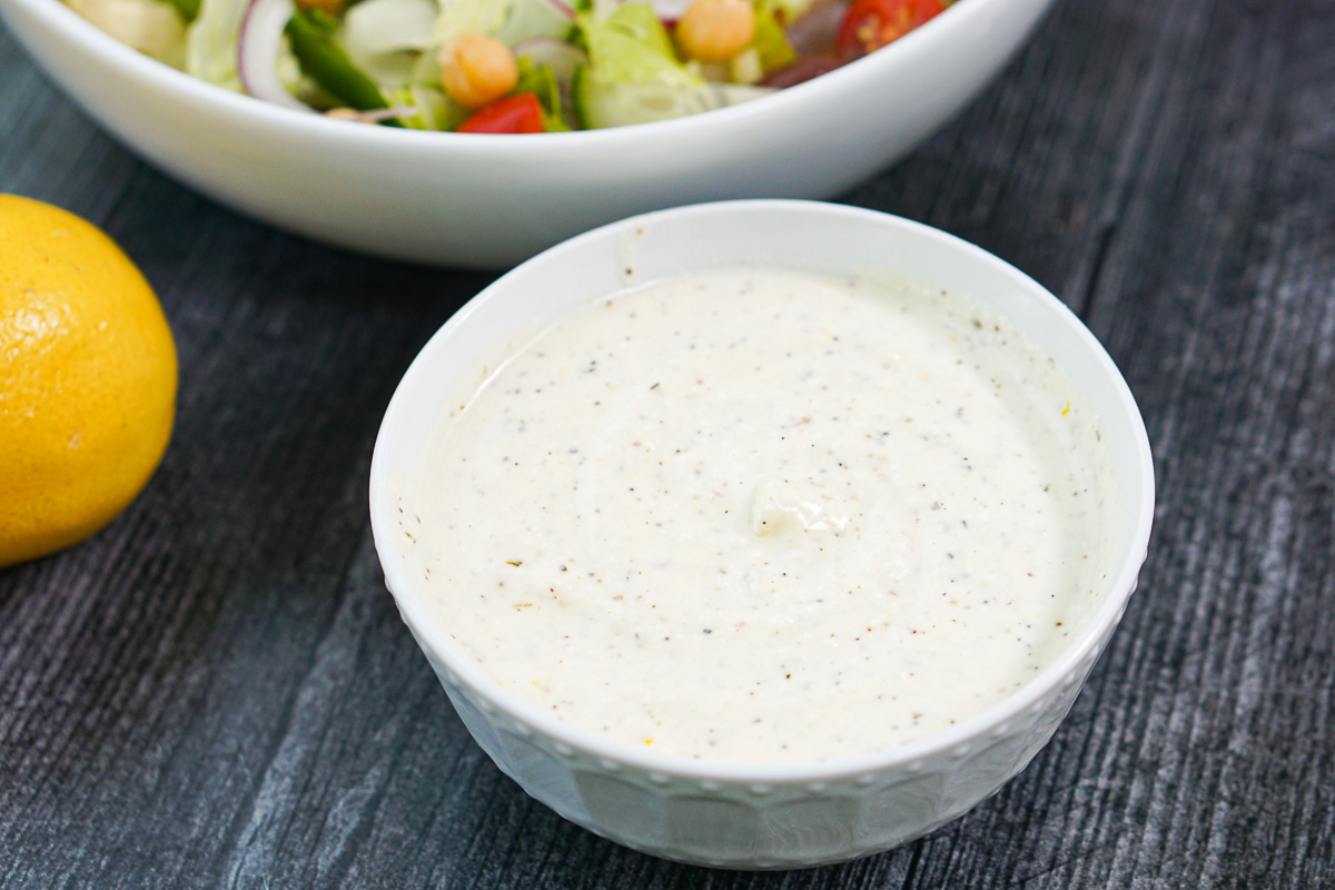 white bowl with creamy salad dressing