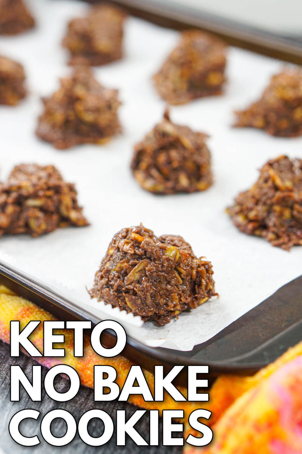 cookie sheet covered in parchment paper and keto no bake cookies on it with text