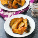 plates with acorn squash fries made in air fryer and text