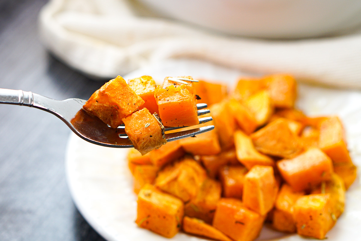 a forkful of chopped roasted sweet potatoes