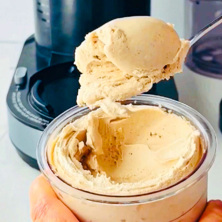 a spoonful of keto cinnamon ice cream with Ninja Creami machine in the background