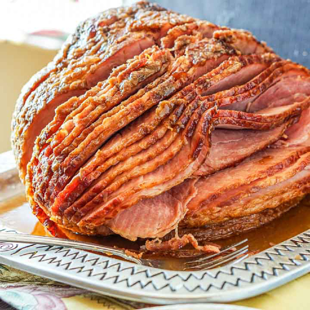 large spiral ham with sugar free glaze on a silver platter