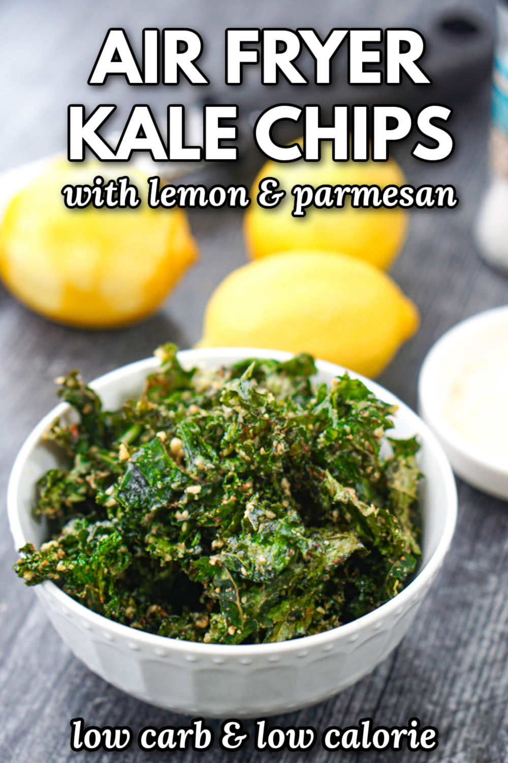 white bowl with air fryer kale chips with fresh lemons and parmesan cheese and text