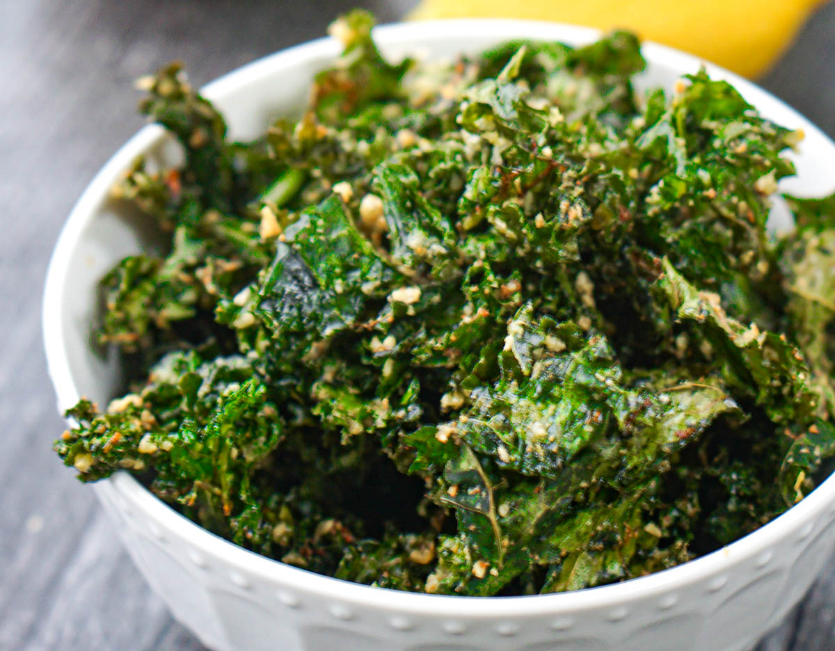 closeup of a white bowl with parmesan kale made in the air fryer