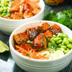 aerial view of keto teriyaki salmon bowls with fresh cilantro and limes with text