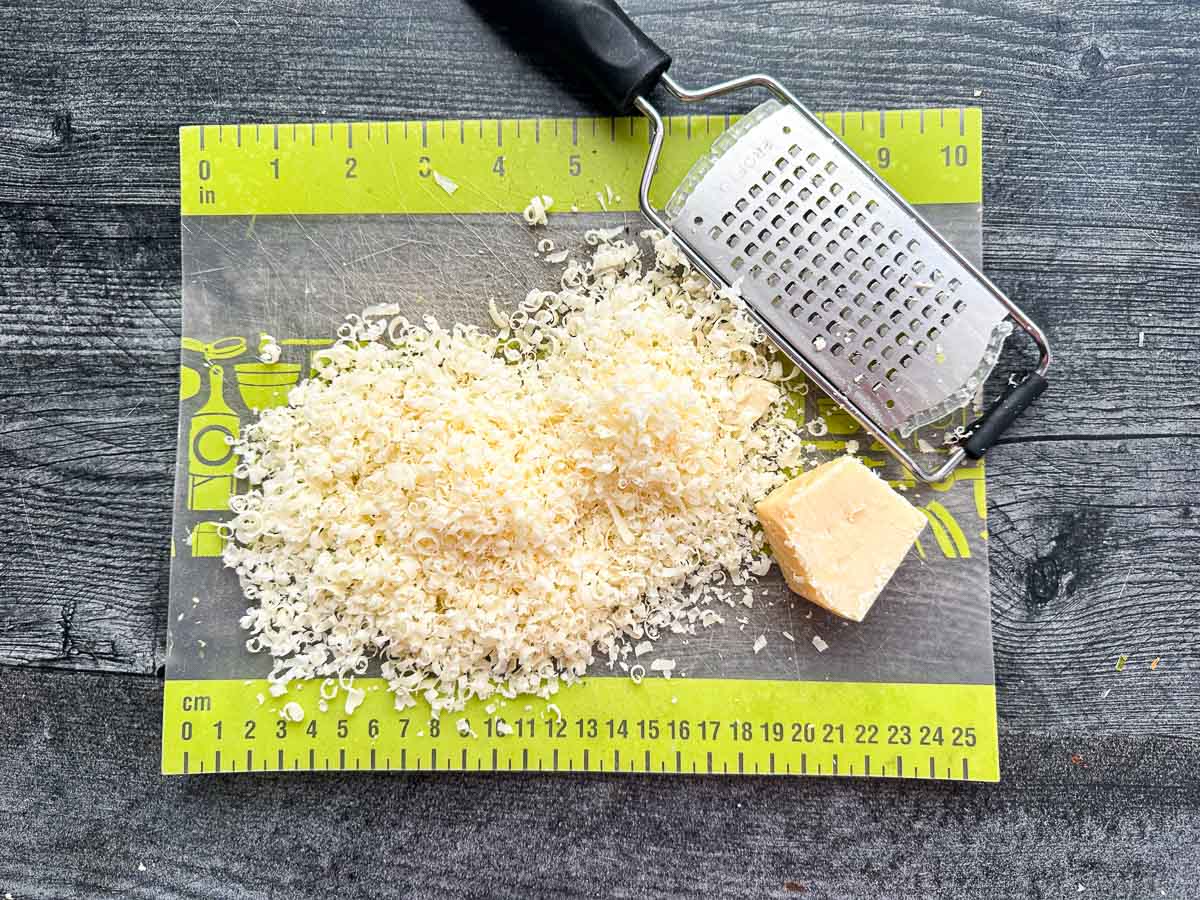 cutting board with fresh shredded parm