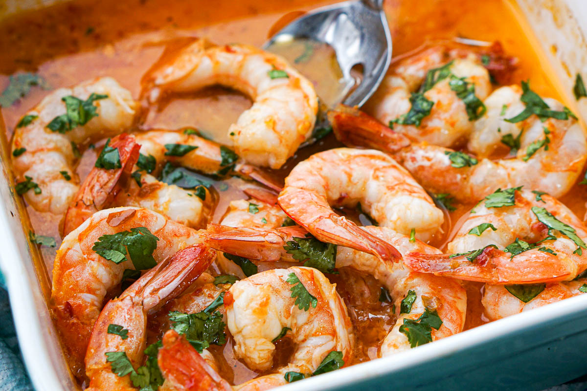 closeup of baking dish with spicy shrimp with cilantro
