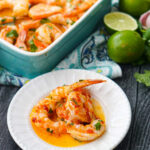 blue baking dish and white plate with keto Yucatan shrimp with fresh limes and cilantro and text