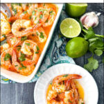 aerial view of a blue baking dish and white plate with keto Yucatan shrimp with fresh limes and cilantro and text
