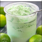 pint container with Ninja cream keto coconut lime ice cream and few fresh limes and text