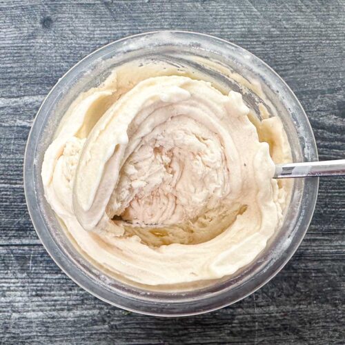 Ninja Creami sugar free butterscotch ice cream in a pint container with a spoon