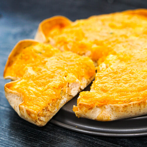 closeup of buffalo chicken tortilla quiche with piece cut out
