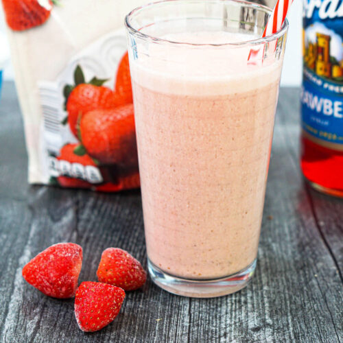glass with healthy strawberry smoothie with frozen strawberries
