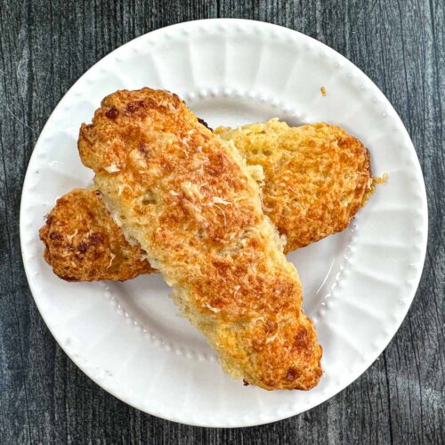 white plate with 2 low carb cottage cheese bread sticks