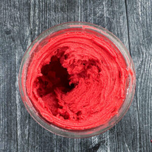 A pint container with the finished Ninja Creami raspberry sorbet.