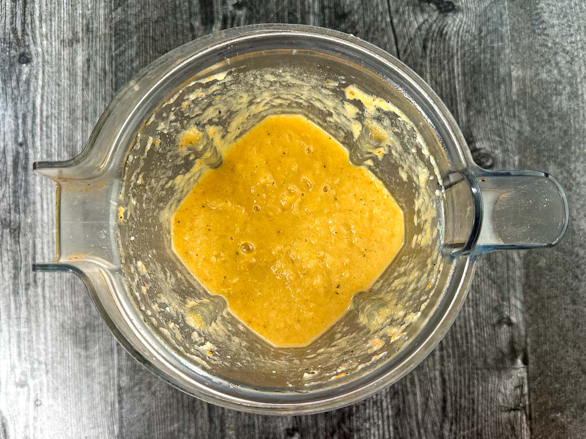 Aerial view of a blender pitcher with the pureed Jerusalem artichoke soup.