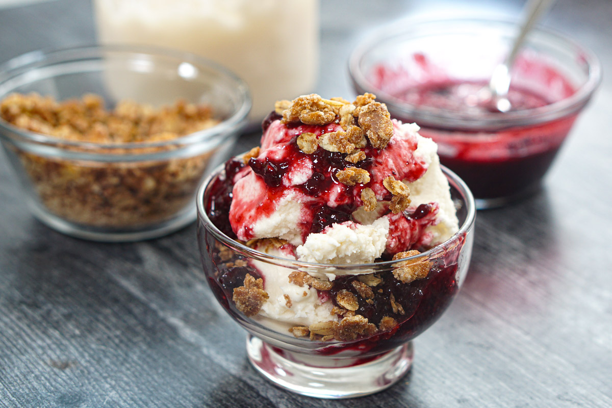 Closeup of the finished Ninja Creami crumble ice cream with the toppings in the background.