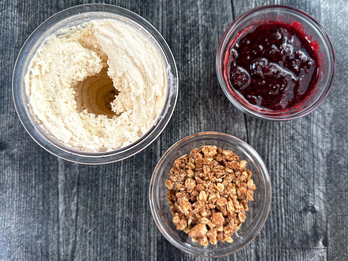 Three basic ingredients - Ninja Creami protein vanilla ice cream, sugar free crumble, sugar free berry sauce.