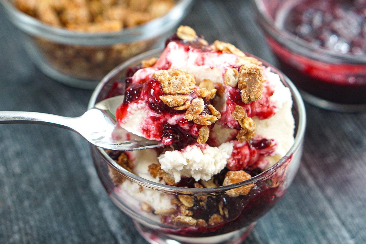 Closeup of a spoonful of the keto berry crumble ice cream.