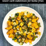 Close up of a white bowl with air fry delicata squash with peppers and onions and text overlay.