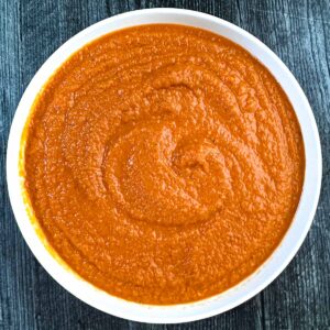 White bowl filled with veggie pasta sauce.