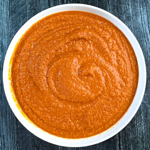 White bowl filled with veggie pasta sauce.