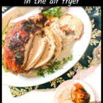 A platter and plate with carved air fryer turkey breast.
