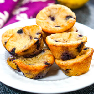 White plate keto cottage cheese blueberry muffins.