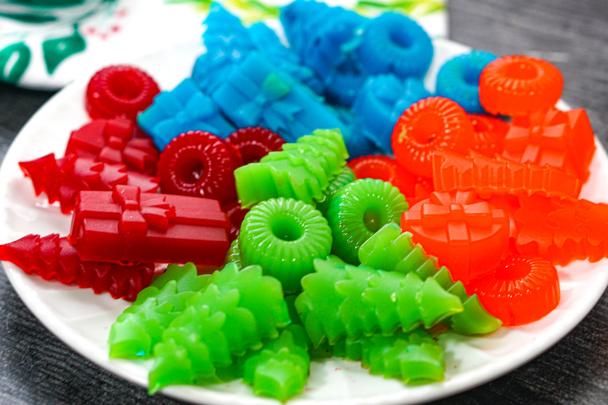 White plate with a different colored and flavored finished keto sugar free gummies recipe.