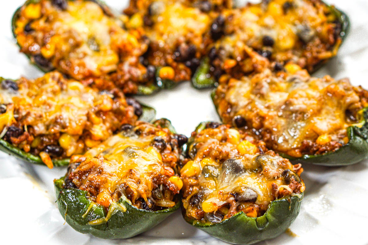 Closeup of a platter of all the stuffed peppers.