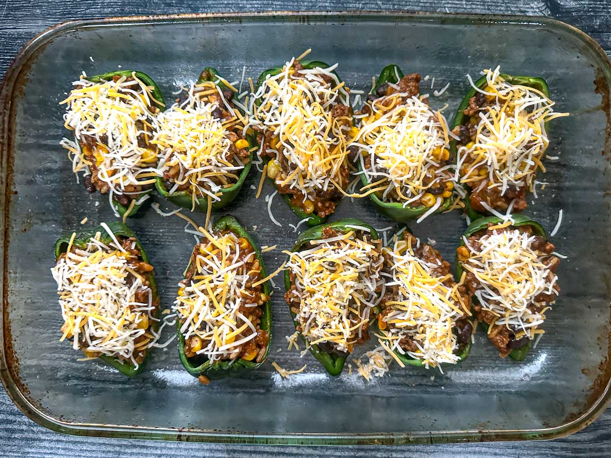 Baking dish with the stuffed peppers ready to bake.