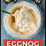 Aerial view of a pint of creamy keto egg nog ice cream and a spoon sticking out and text.