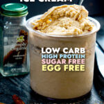 A pint of creamy keto egg nog ice cream and a spoon sticking out and text.