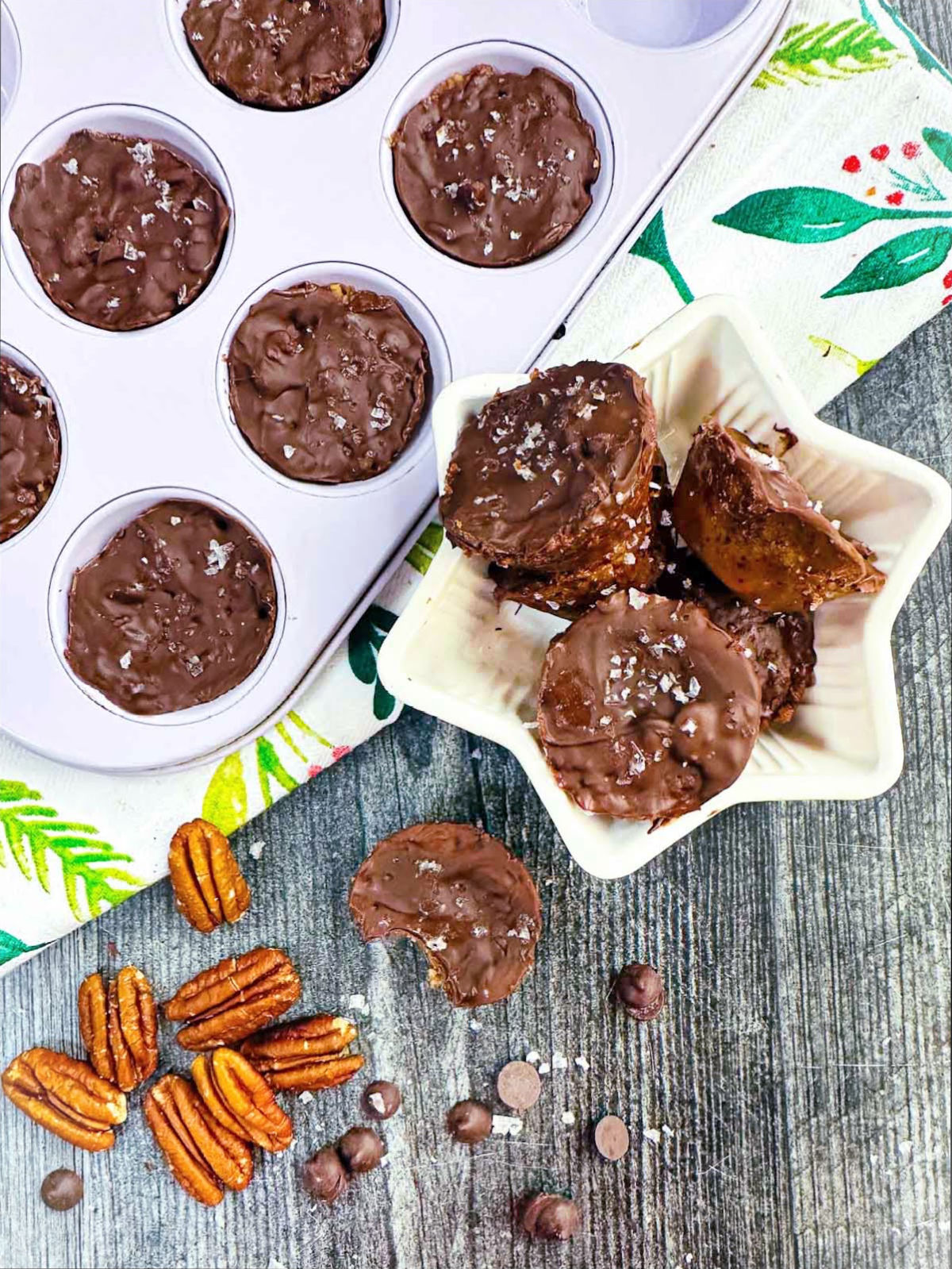 Aerial view of muffin tin and white candy dish with keto toffee candy.